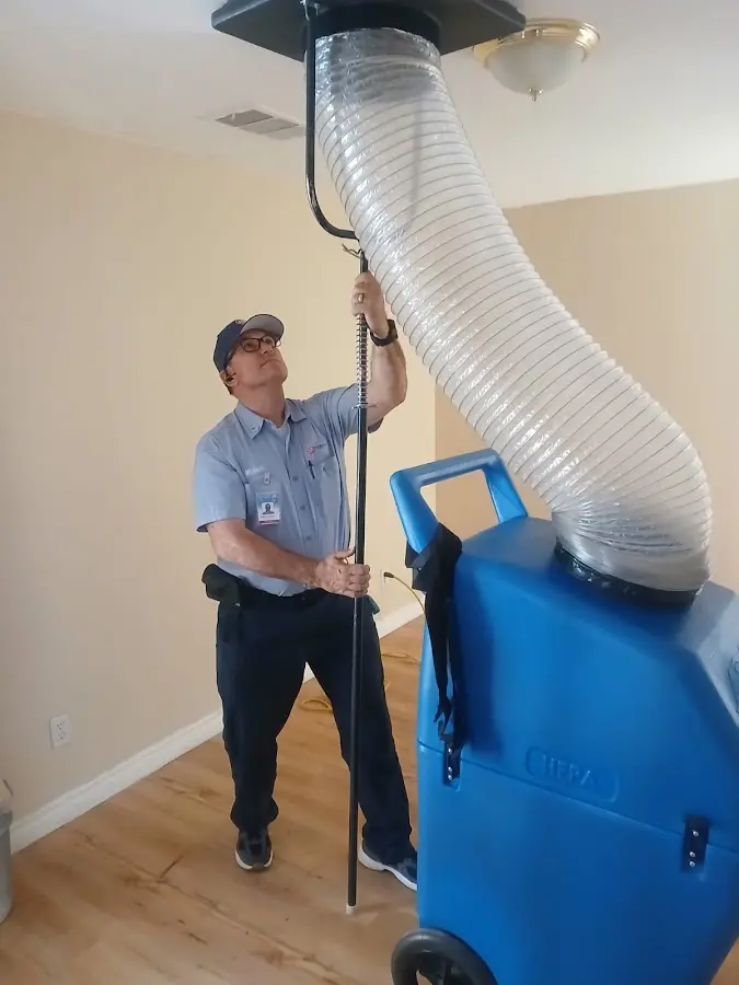 Furnace Tune-Up technician using HEPA equipment in Phenix City